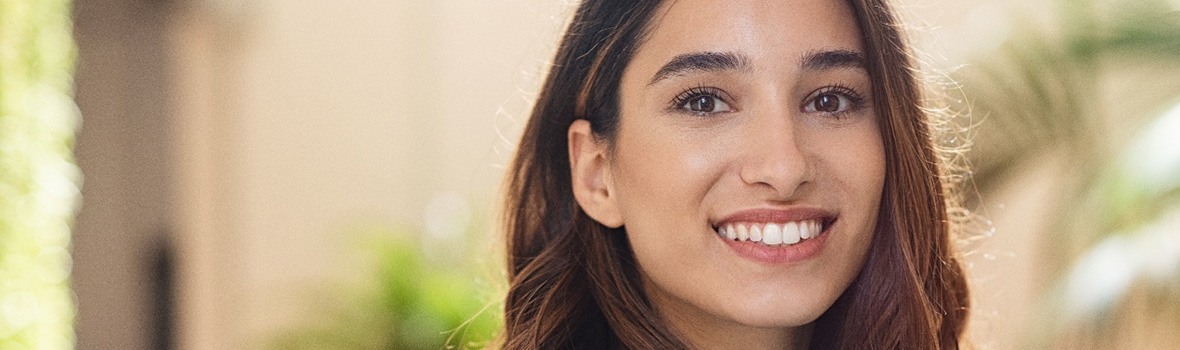 A closeup of a happy young woman smiling